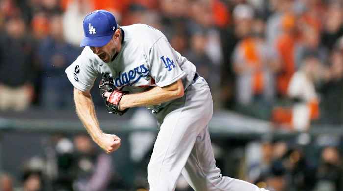 Oct 14, 2021; San Francisco, California, USA; Los Angeles Dodgers pitcher Max Scherzer (31) celebrates recording the final out against the San Francisco Giants in the ninth inning during game five of the 2021 NLDS at Oracle Park.